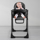 Baby sitting in Silver Cross Gourmet High Chair - Black