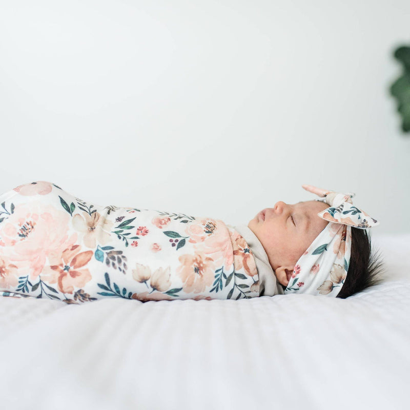 Swaddled baby sleeps while wearing Copper Pearl Knit Headband Bow - Autumn