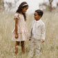 Boy wearing Noralee Sebastian Pant - Fog standing next to girl