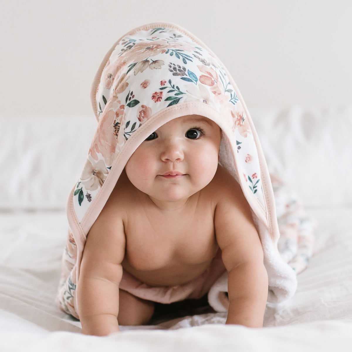 Baby crawls wrapped in Copper Pearl Knit Hooded Towel - Autumn