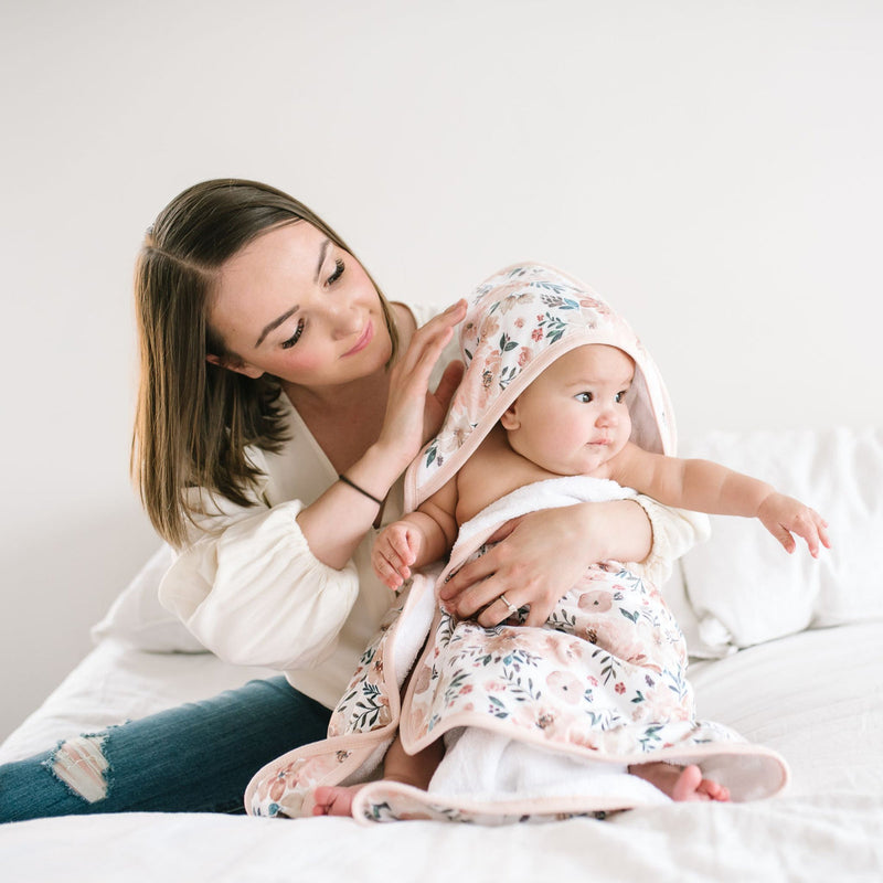 Mom holds baby wrapped in Copper Pearl Knit Hooded Towel - Autumn