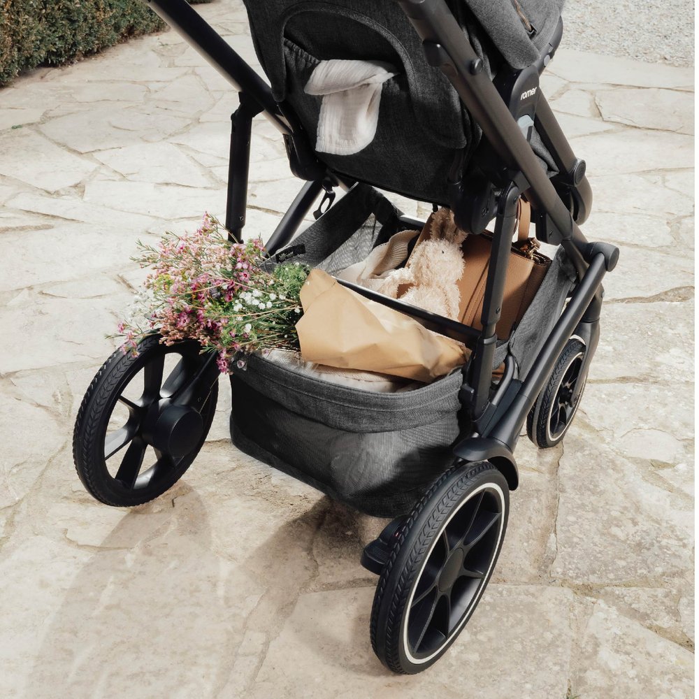 Flowers and stuffed bunny stowed in storage basket of Romer Tura Stroller - Peppercorn